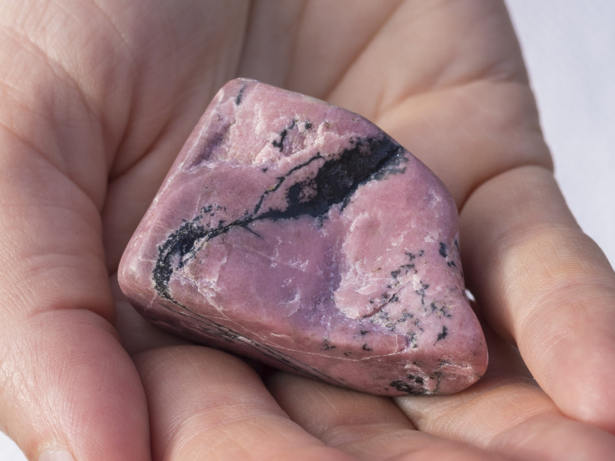 Black on sale rhodonite meaning