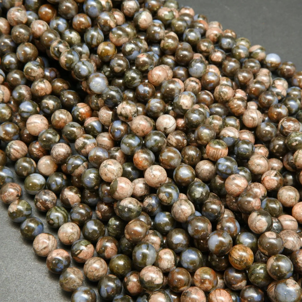 Blue quartz and pink feldspar in brown round beads.