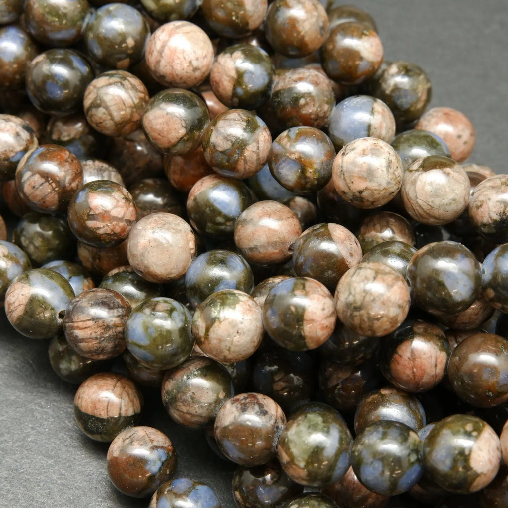 Blue quartz and pink feldspar in brown round beads.