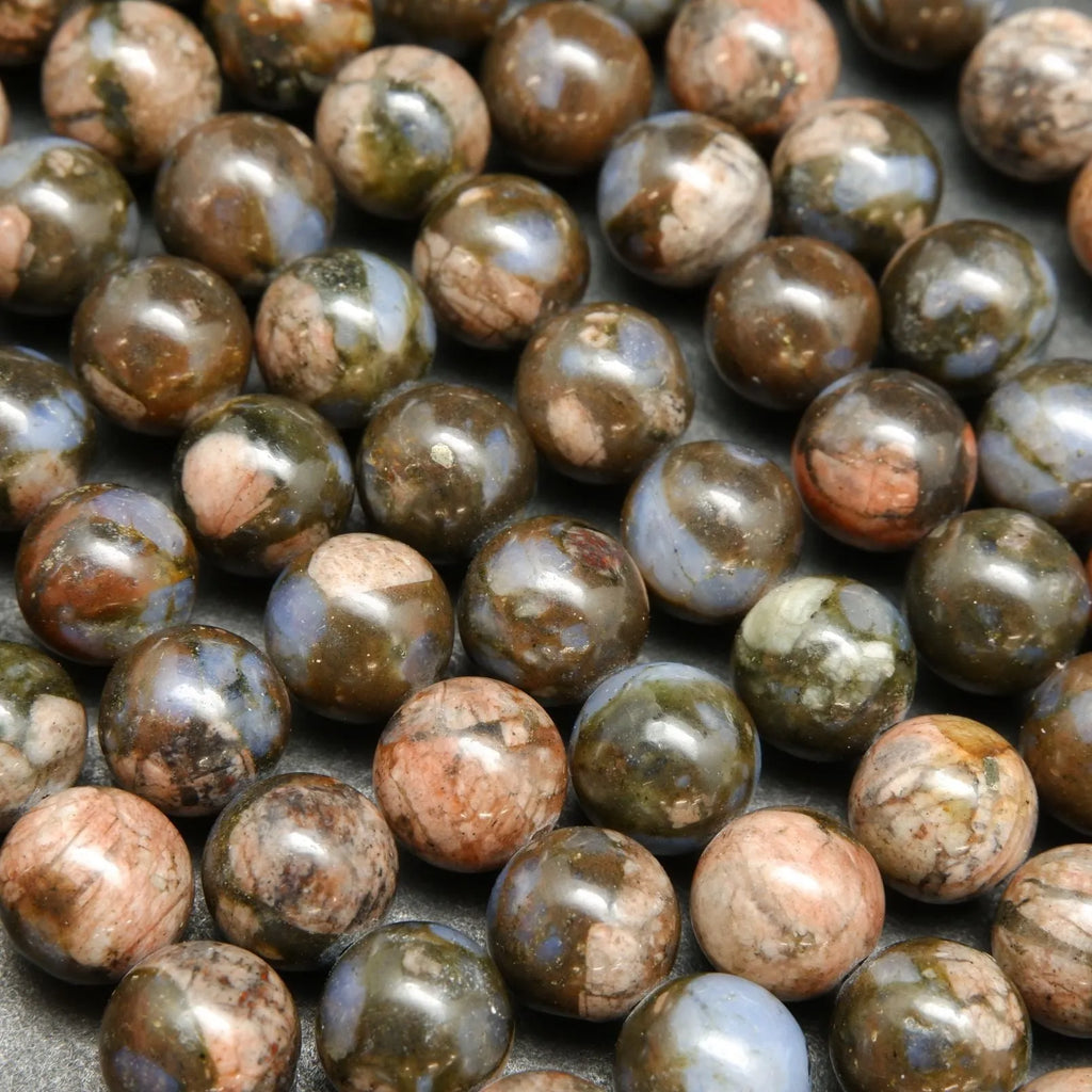 Blue quartz and pink feldspar in brown round beads.