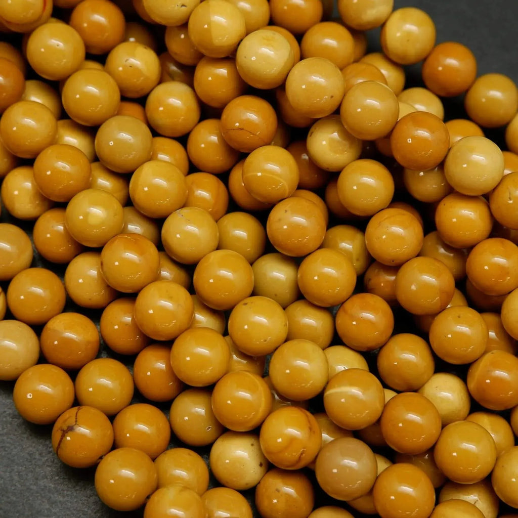 Round yellow beads for jewelry making. Australian Yellow Mookaite loose beads.