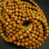 Round yellow beads for jewelry making. Australian Yellow Mookaite loose beads.