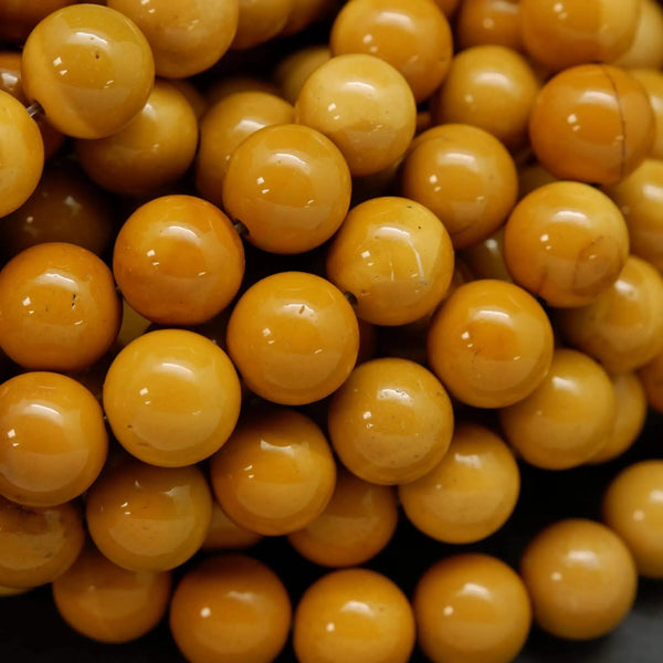 Round yellow beads for jewelry making. Australian Yellow Mookaite loose beads.