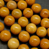 Round yellow beads for jewelry making. Australian Yellow Mookaite loose beads.