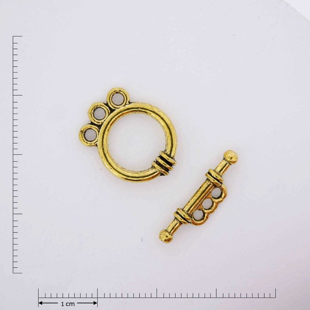 Gold triple ring toggle.