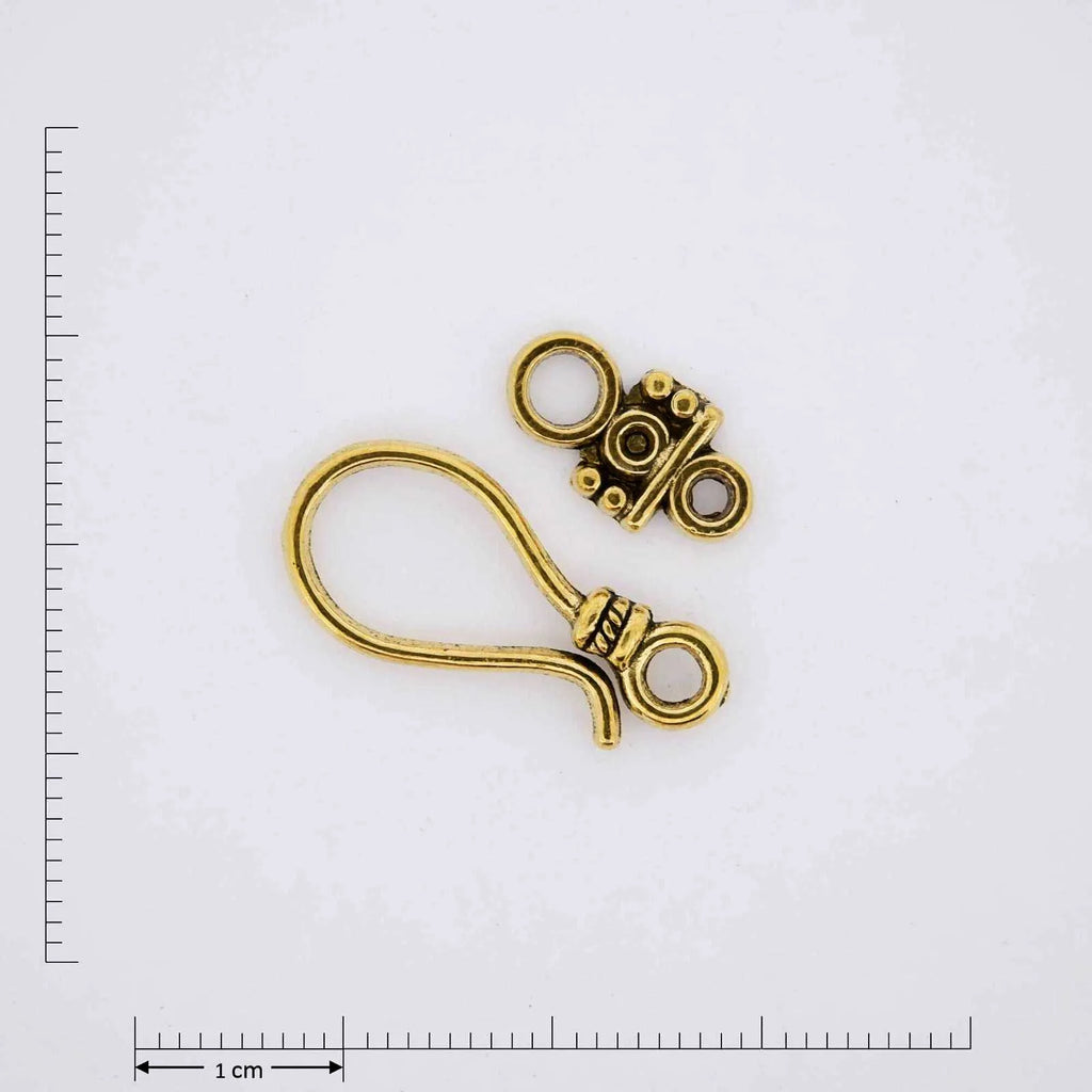 Gold jewelry finding hook clasp.